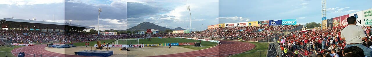 General view of a football stadium pitch and empty stands before kickoff