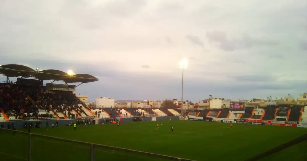 General view of an empty football stadium's pitch and stands before kickoff