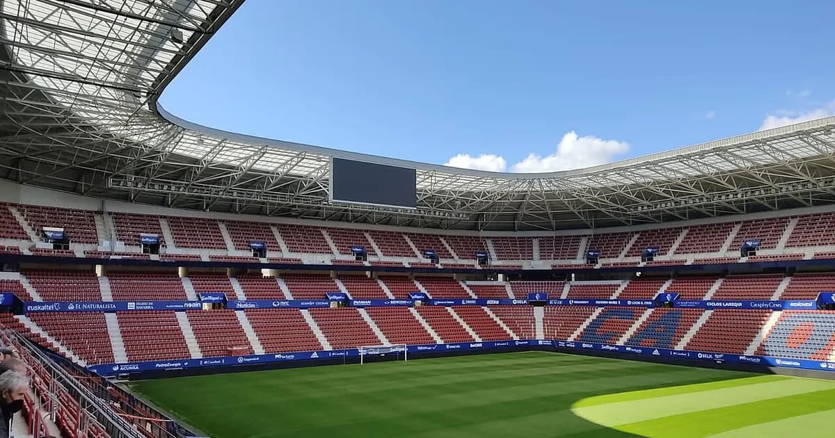 General view of an empty football stadium's pitch and stands before kickoff