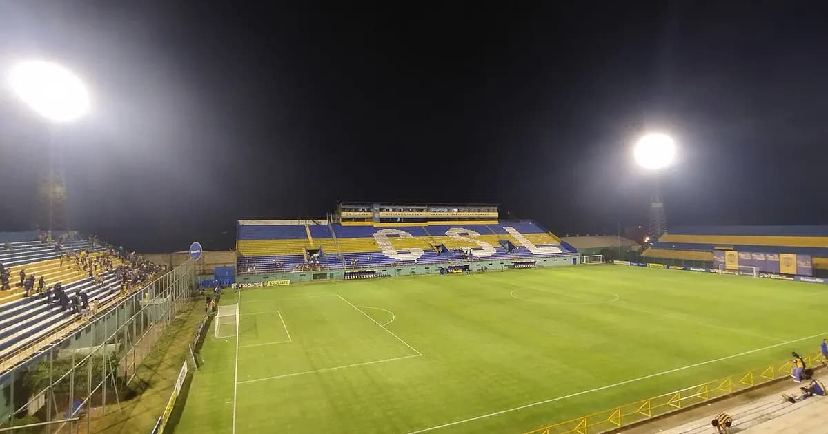 Empty football stadium seating and pitch ahead of kickoff between Sportivo Luqueño and Guaraní